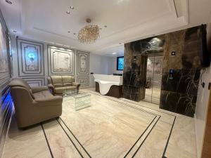 a bathroom with a tub and a sink and a bath room at Hotel Plaza 14 Jammu, Near Railway Station in Jammu +29 photos