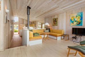 a living room with a couch and a table at 8554-Grenaa-Bertavej-25 in Brøndstrup