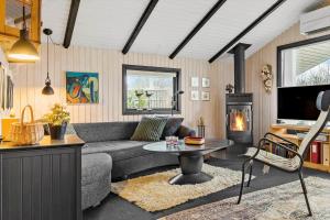 a living room with a couch and a table at 8531-Grenaa-Annettevej-9 in Brøndstrup