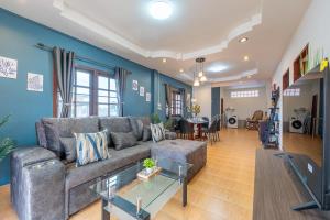a living room with a couch and a table at Serenity Holiday Villa 2, Karon Beach in Karon Beach