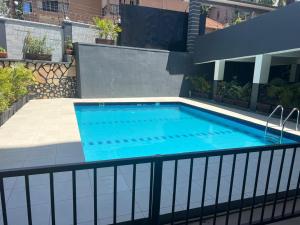 a swimming pool on top of a building at Three bedroom place with lake view in Kampala