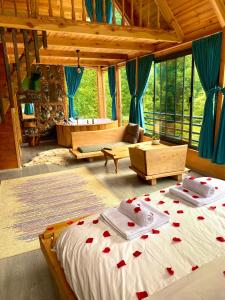 a bedroom with two beds with red hearts on it at Cuneli bungalov in Çamlıhemşin