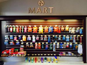 a store shelf with a bunch of differentiatesiatesiatesiatesktop at Ramada by Wyndham Torrance in Torrance