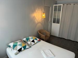 Postel nebo postele na pokoji v ubytování Grand 2 pièces proche quai de l'Isère