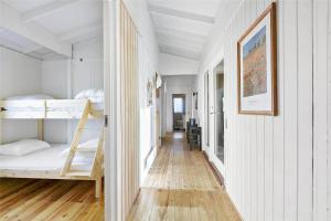a hallway with bunk beds in a white room at 1158-N-Liseleje-Rugskellet-9 in Liseleje