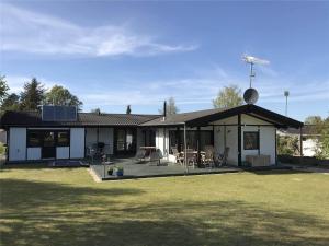 a house with a large yard with a patio at 1158-N-Liseleje-Rugskellet-9 in Liseleje