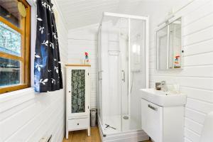 a white bathroom with a shower and a sink at 1139-N-Liseleje-Haldsvej-2 in Liseleje +14 photos
