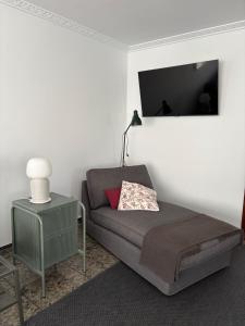a living room with a couch and a lamp at Vicedo Bay View in O Vicedo