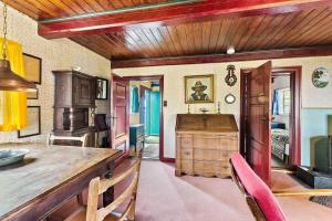 a kitchen with a table and chairs in a room at 1102-N-Hundested-Skansevej-45 in Hundested