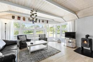 a living room with a couch and a fireplace at 617-N-Melby-Bakkely-8-B in Melby