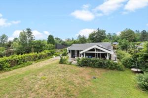 a house on a hill with a yard at 1517-Melby-Lindebjergvej-78 in Melby