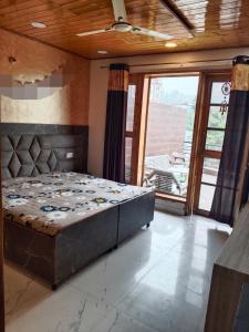 En eller flere senge i et værelse på Solan Vista