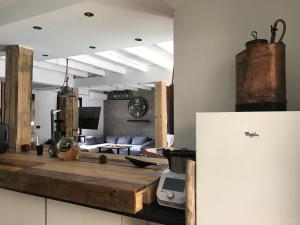 a living room with a couch and a table at Maison belle-vie in Corconne