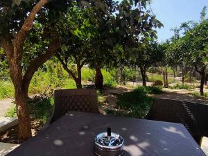 a black table with a drink on top of it at Gastouni Urban stay in Gastoúni