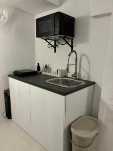 a small bathroom with a sink and a toilet at Allegra's Guest House in Ostuni