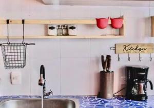 a kitchen with a sink and a counter top at Amano Property in Santa Marta