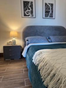 a bedroom with a bed and a lamp on a night stand at New & Chic 3-Bedroom Penthouse, Punta Cana, Pool-BBQ-Beach Access-Private Rooftop-Padel y Sports amenities in Punta Cana +39 photos