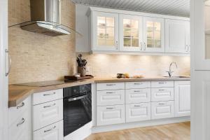 Η κουζίνα ή μικρή κουζίνα στο BL1206-Blokhus-Blaabaervej-6 +18 φωτογραφίες