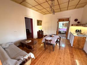 a living room with a couch and a table in it at Vardis Guesthouse in Gyumri