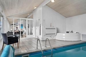 a large bathroom with a tub and a sink at BL738-Saltum-Graabakken-53 in Saltum