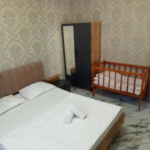 Ένα ή περισσότερα κρεβάτια σε δωμάτιο στο Gabala Brend Villas