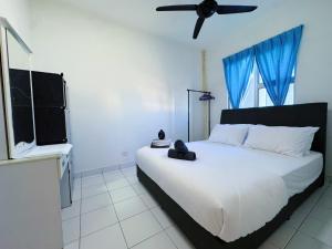 Ένα ή περισσότερα κρεβάτια σε δωμάτιο στο Putrajaya Casa Apartment Presint 17, 62000, Putrajaya, Selangor