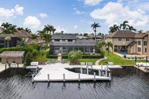 a large house on the water with a dock at Rock'n Waterfront in Cape Coral