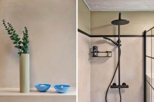 a bathroom with a shower and a vase with a plant at BL1466-Pandrup-Lunekrogen-14 in Pandrup