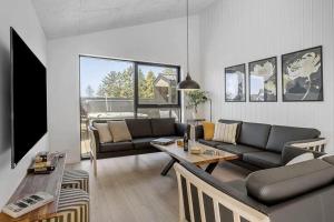 Televiisor ja/või meelelahutuskeskus majutusasutuses BL1257-Saltum-Vesterhavs-Sletten-35