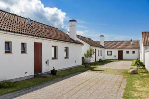 a row of white houses with brown roofs at BL1397-Pandrup-Rodhus-Klitvej-363 in Pandrup