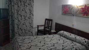 Cama ou camas em um quarto em Hotel Peralba