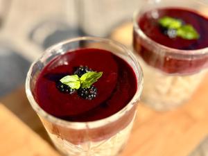 two glasses of red sauce with a plant in it at Voilà Le Logat - Chambres & Gîtes in Sainte-Gemme +72 photos