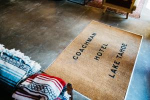 a welcome mat on the floor with the words out of service at The Coachman Hotel in South Lake Tahoe