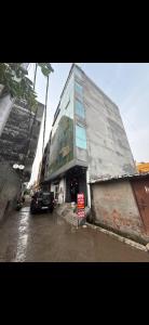 a large building with a sign in front of it at Hotel IC TOWER in Noida