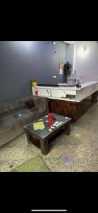 a living room with a table and a sink at Hotel IC TOWER in Noida