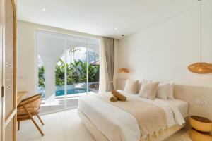 Ένα ή περισσότερα κρεβάτια σε δωμάτιο στο Villa Valli 3, Luxury Mediterranean Villa Bingin