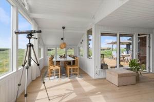 a camera on a tripod in a room with a table at BL1020-Pandrup-Hunetorp-Klitvej-257 in Pandrup