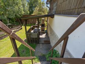 a stairway leading up to a building with a wooden railing at Holiday Home Lenora II by Interhome in Lenora