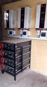 a counter with a bunch of appliances on a wall at Queen Zee Boutique Hotel in Kololi