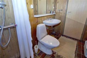 a bathroom with a toilet and a sink at BL363-Saltum-Nyborgvej-4 in Saltum +8 photos