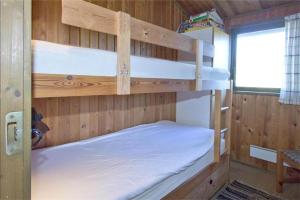a bedroom with two bunk beds in a cabin at BL363-Saltum-Nyborgvej-4 in Saltum