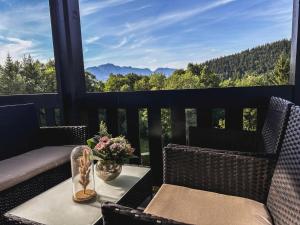 a balcony with a table and chairs with a view at Apartment Am Obersalzberg by Interhome in Berchtesgaden