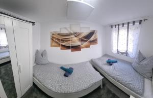 Ένα ή περισσότερα κρεβάτια σε δωμάτιο στο Casa Mia 37 am See