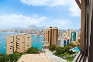 a view of a city with buildings and the ocean at Oasis Levante Beach Benidorm - Trinisol II in Benidorm