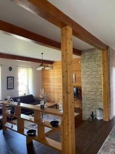 a living room with a table and a couch at Camere de Inchiriat Ceahlau in Ceahlău