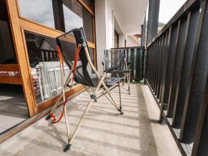 a balcony with two chairs on a porch at Studio 2 pers. Sud avec balcon à Valloire - FR-1-263-53 in Valloire