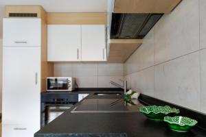 a kitchen with a sink and a counter top at Haus Snow Fun B in Saas-Fee +10 photos