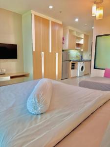 a large bed with a pillow on it in a room at Супер апартаменты Найтон Naithon in Nai Thon Beach +14 photos