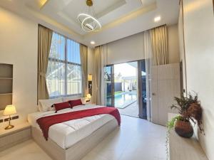 Postel nebo postele na pokoji v ubytování Pattaya Dream Pool villa + 43 fotografií