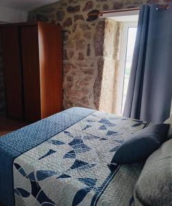 Postel nebo postele na pokoji v ubytování Casa do Regedor